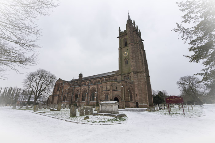 Snow scene featuring All Saints Church
