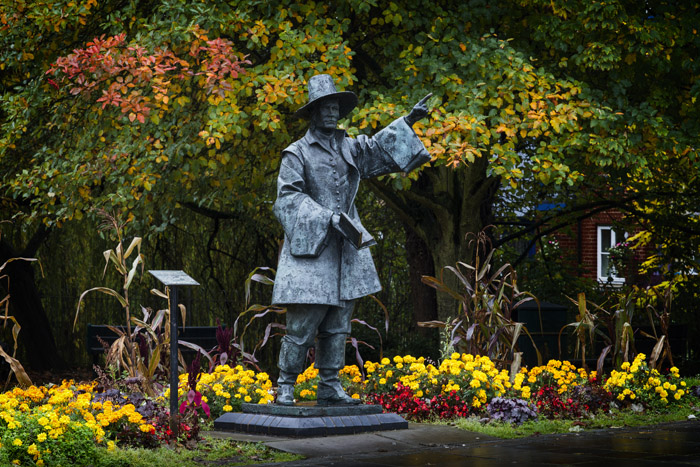 Statue of Samuel Stone in autumn