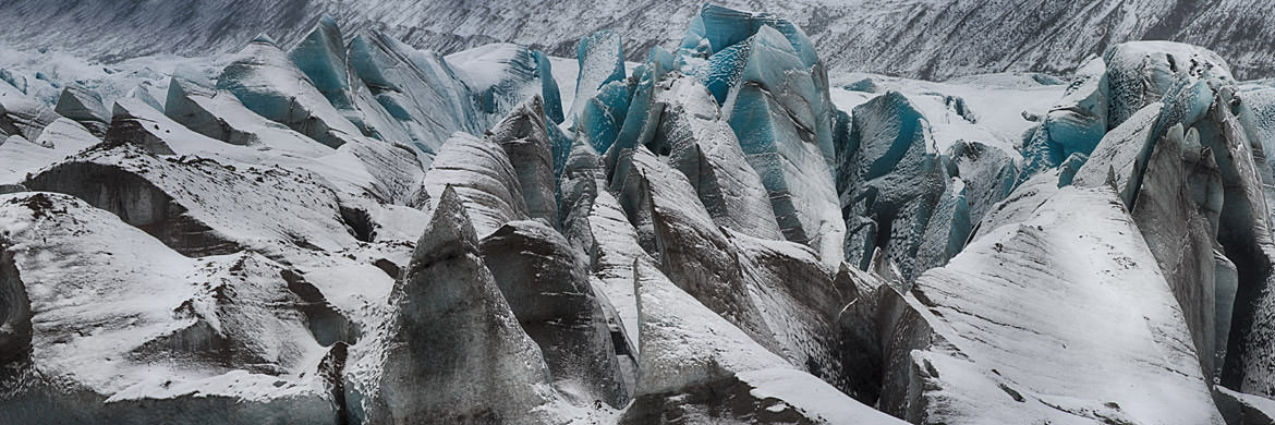 Blue ice patterns in a glacier in Iceland.