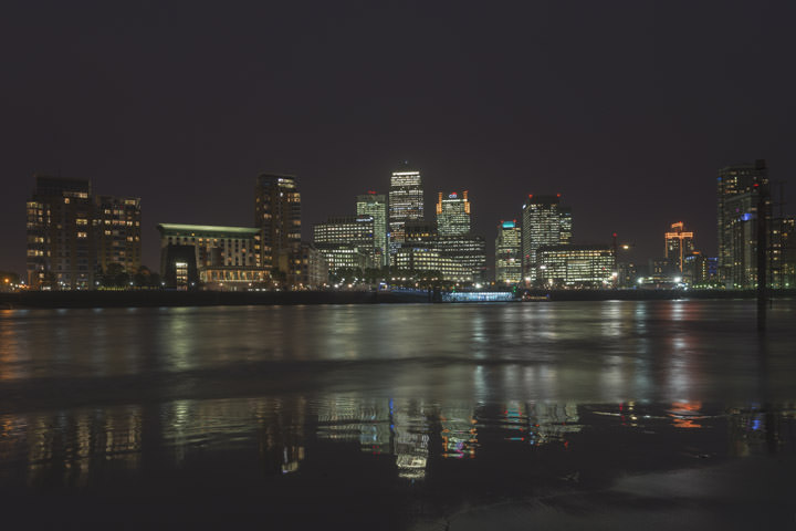 A night scene of Canary Wharf viewed from Rotherhithe