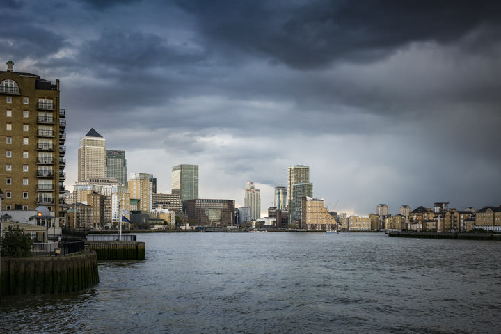 The Canary Wharf Skyline viewed from the River Thames on a stormy day