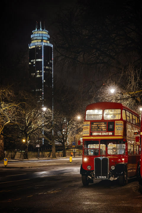 London Bus in front of  St Georges Tower at night