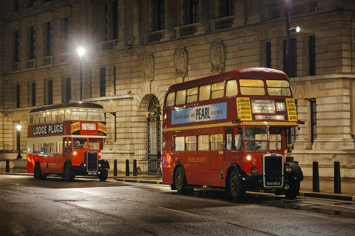 Two vintage London buses at Westminster in London