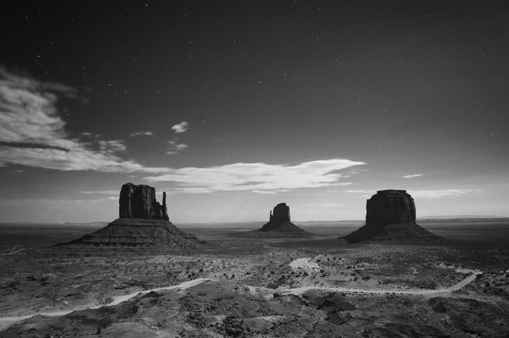 Monument Valley in black and white at dawn.