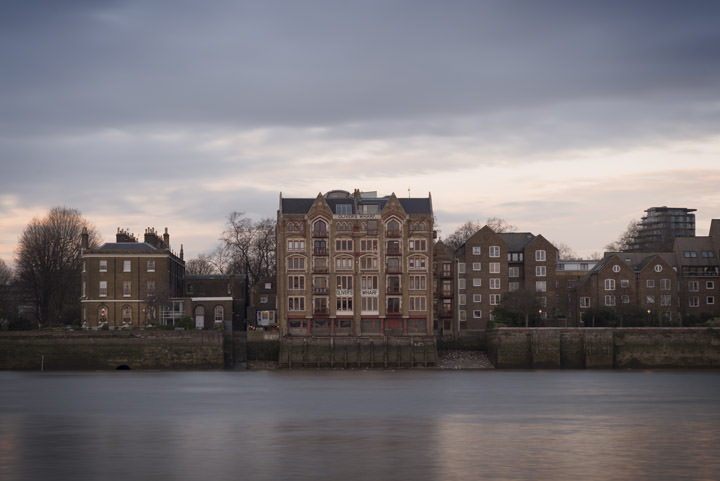 Olivers Wharf and the River Thames at dusk on a stormy day at Wapping in Tower Hamlets