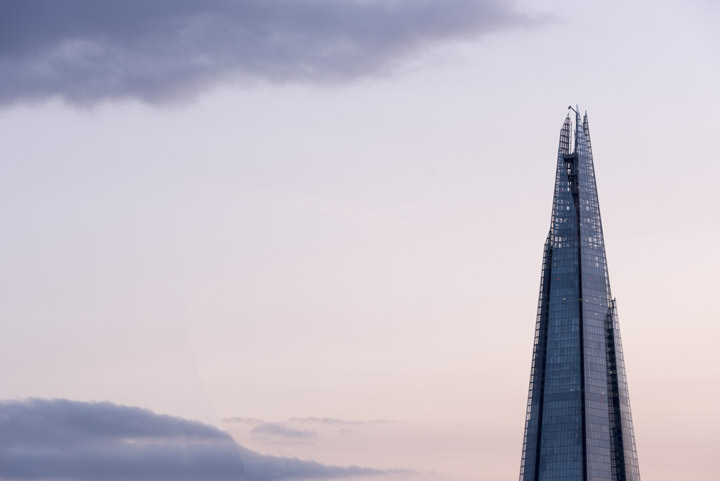 The top of the Shard in a pink sky