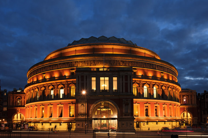 The brightly lit Royal Albert Hall at dusk 