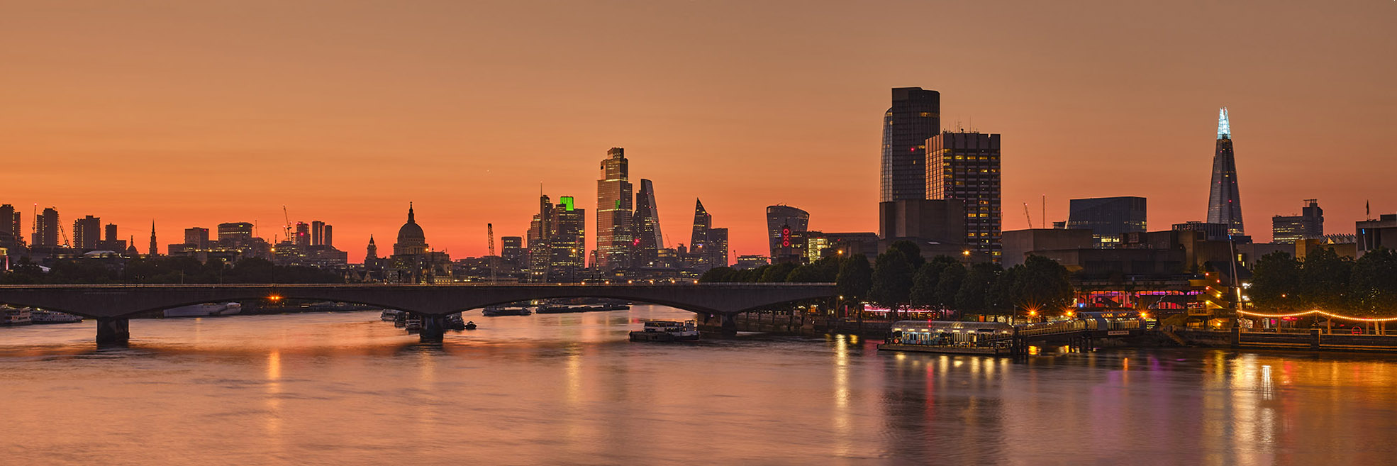 Photograph of the London skyline and River Thames at dawn