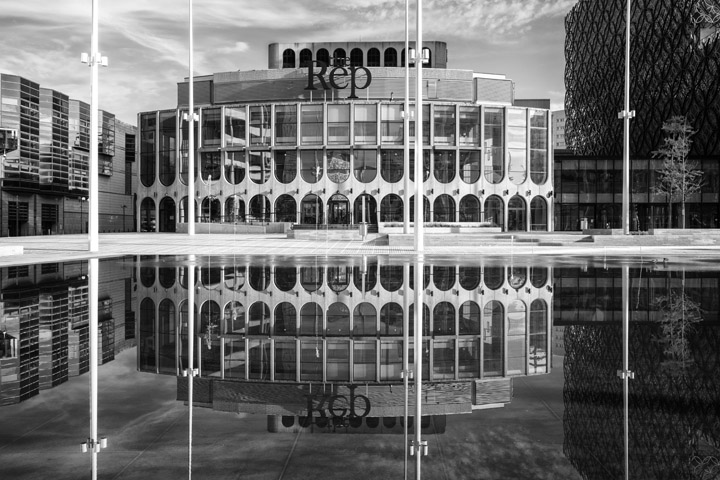 Black and white photo of Birmingham Rep  and reflectiuon at centenary square
