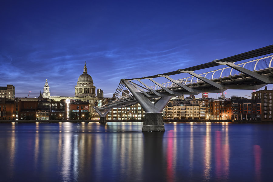 Blue dawn St Pauls Cathedral and the Millennium Bridge from west