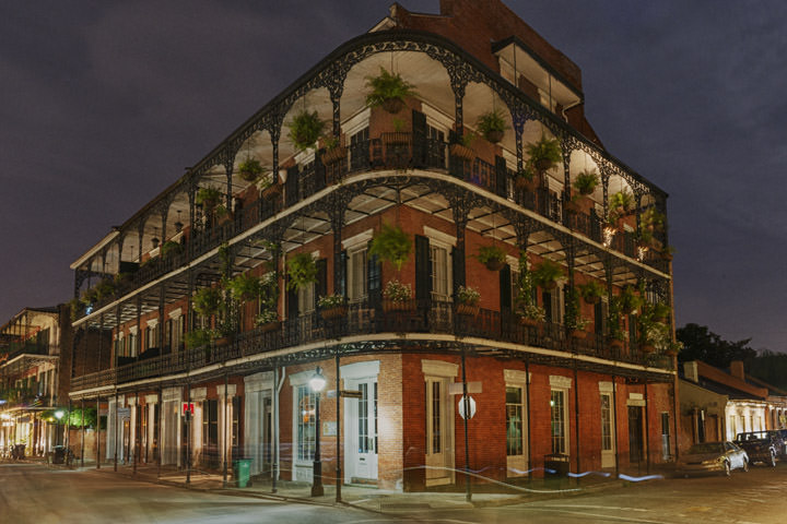 Plantation style building in Bourbon Street , New Orleans at night.