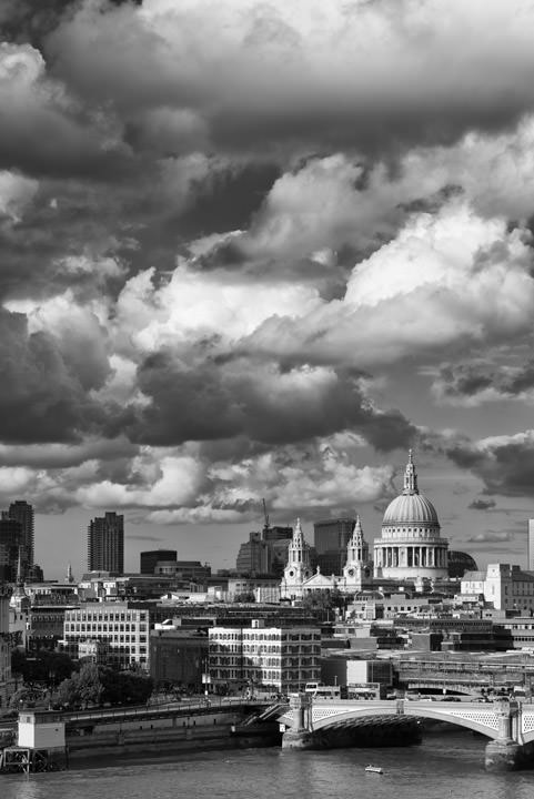 London City Skyline featuring St Pauls Cathedral and dramatic clouds