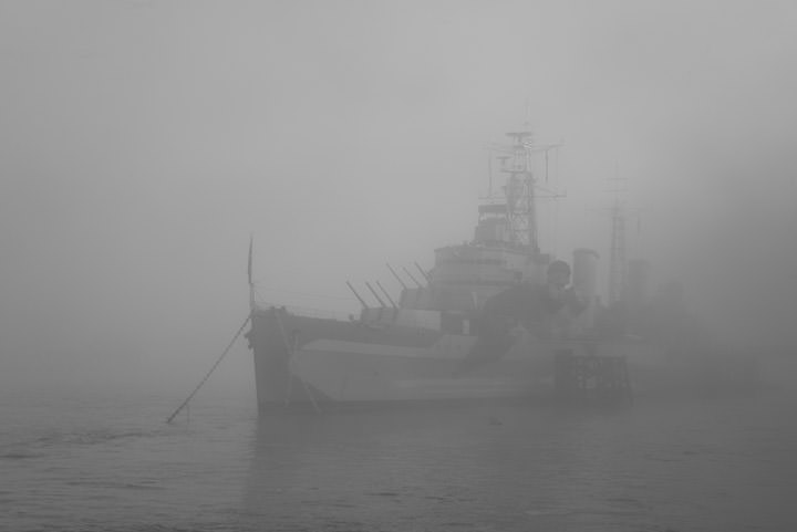 HMS Belfast on River Thames in heavy mist