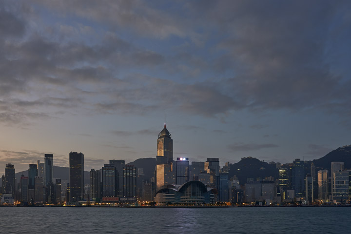 Hong Kong waterfront beneath pretty clouds at dawn