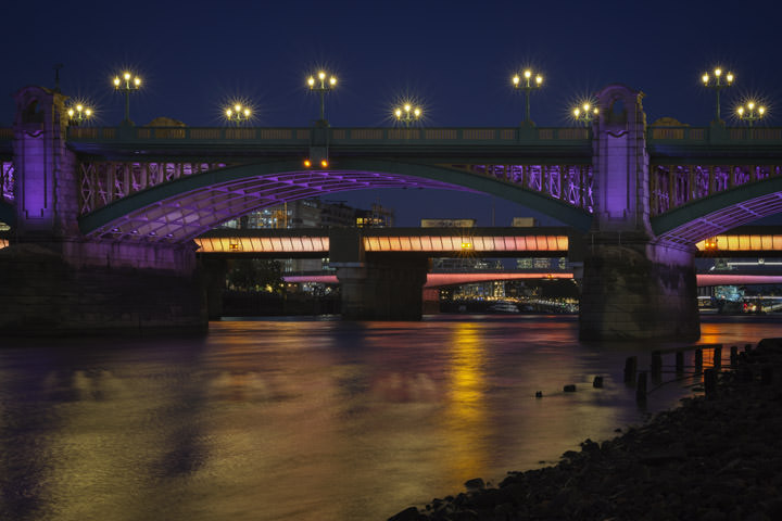 Blackfriars Bridge, Canon Street Bridge, London Bridge and Tower bride lit at night as part of the Illuminated River