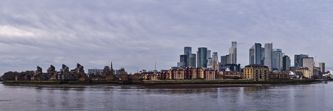 Isle of Dogs wide panorama showing Canary Wharf docklands and traditional buildings