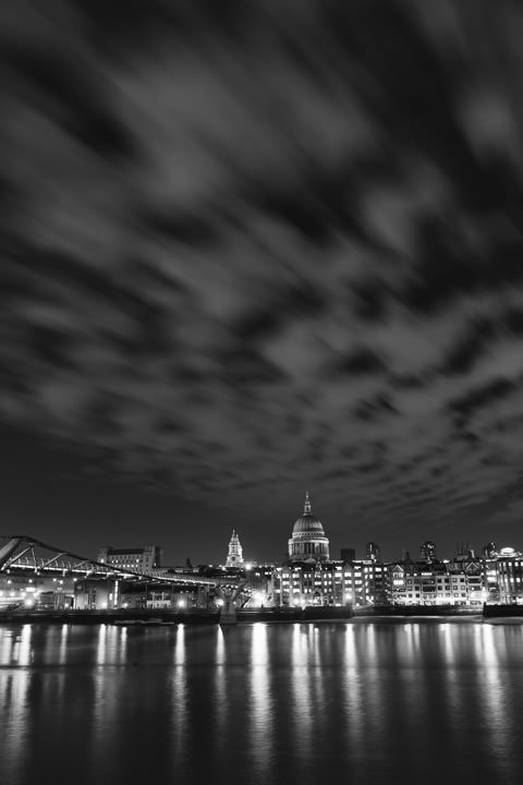 Vertical image of St Pauls Cathedral at night  in black and white
