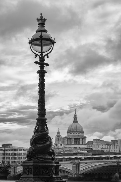 Traditional street lamp and St Pauls Cathedral in black and white