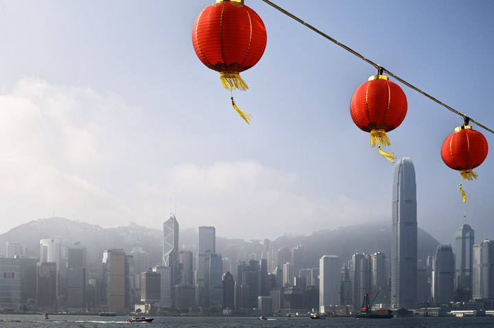 Red lanterns and Hong Kong Skyline from Kowloon at daytime